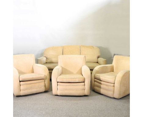 An Art Deco four piece suite, comprising three armchairs and a matching sofa, 195cm wide. According to the family these were 