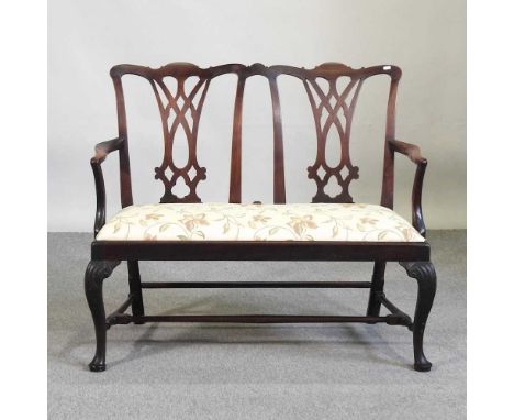 A 19th century Chippendale style chairback sofa, with a padded seat, on cabriole legs111w x 54d x 96h cm