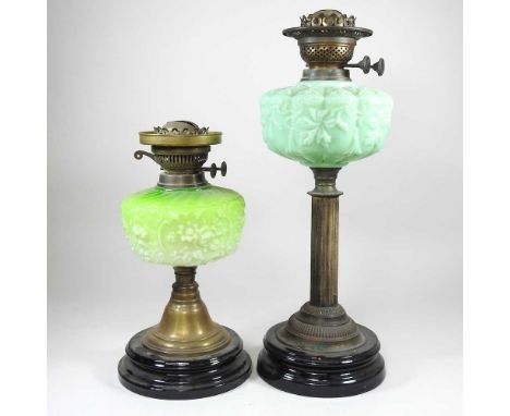 An oil lamp, with a green glass reservoir, 48cm high, together with another smaller (2)Both are dirty and metal is dull. They