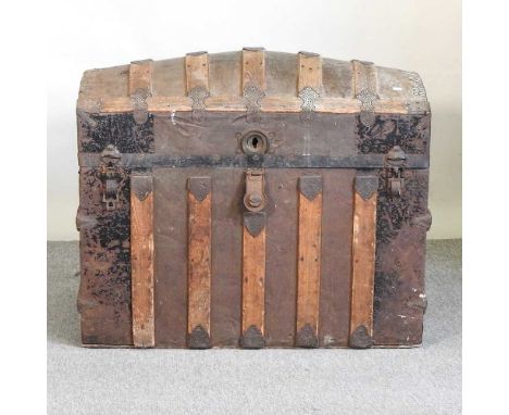 A Victorian dome top and wooden bound trunk, with a fitted interior86w x 52d x 75h cm