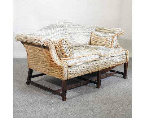 An early 20th century green upholstered camel back sofa, on square legs163w x 80d x 86h cmThis was collected from a house whe