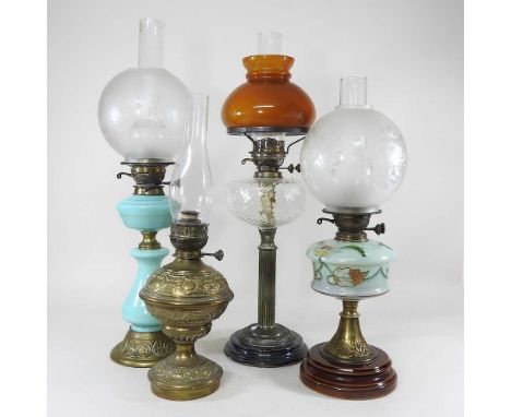 A 19th century turquoise opaline glass oil lamp, with an etched glass shade, 61cm high, together with three others (4)work
