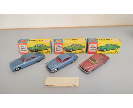 Corgi Toys- Three boxed Jaguar X model cars no 238 with Glidamatic suspension, one being the scarce cerise pink variant with 