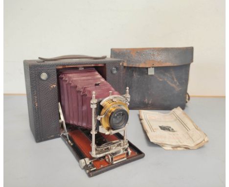 Antique late Victorian Kodak Eastman No 4 model E folding box cartridge camera with red leather bellows and Bausche &amp; Lom