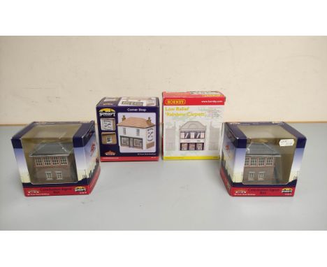 Group of boxed model railway buildings comprising of Bachmann J Barnett corner shop 44-147, two Caledonian signal boxes 44-06