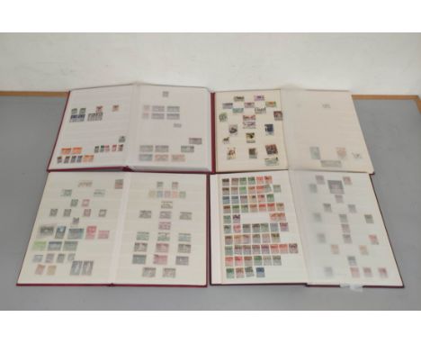 Four well filled world and commonwealth postage stamp albums to include Victorian issues from South Africa &amp; the Gold Coa