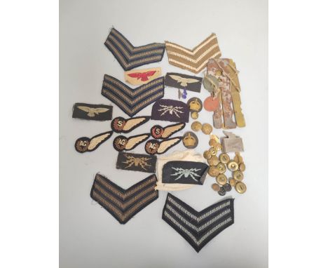 Collection of WW2 patches and buttons including Wireless Operator patch, Air Gunners, Sergeant Stripes button gauges and dog 