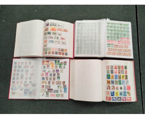 Four well filled World &amp; Commonwealth postage stamp albums to include issues from Ceylon, Cuba, Southern Rhodesia, Romani