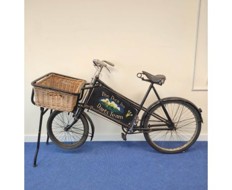 Vintage Gundle shop bike with fitted basket to front and painted advertisements at each side one for the Solway Vintage Guns 