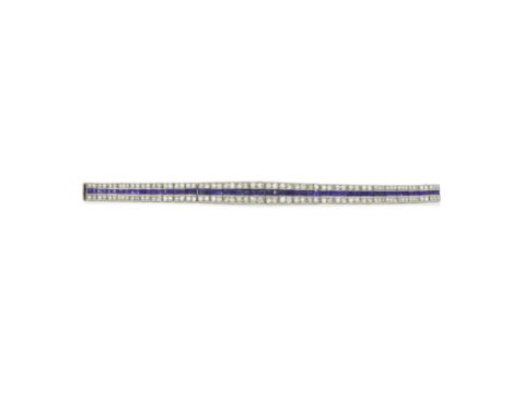 CHAUMET: ART DECO SAPPHIRE AND DIAMOND SET BRACELET, CIRCA 1925The tapering bracelet set with a row of calibré-cut sapphires,