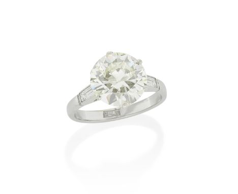 DIAMOND SINGLE-STONE RINGThe brilliant-cut diamond, weighing 4.10 carats, between baguette-cut diamond shoulders, ring size M