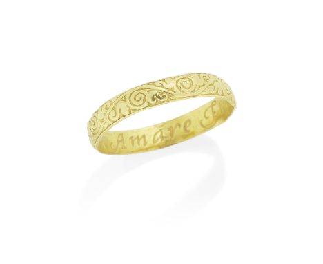 GOLD POSY RING, 17TH CENTURYThe exterior with scroll engraved decoration, interior posy reading 'Amare Furo et periurare nolo