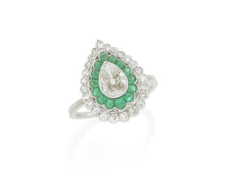 EMERALD AND DIAMOND CLUSTER RING, CIRCA 1920The old pear-shaped diamond, weighing approximately 0.50 carats, within an openwo