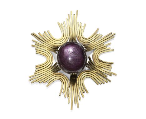 GRIMA: RUBY-MOUNTED PAPERWEIGHT, CIRCA 1970Centrally set with a large ruby cabochon, within a radiating star-shaped surround 