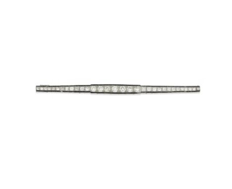 ART DECO DIAMOND AND ONYX BRACELET, CIRCA 1920Set with old brilliant-cut diamonds, graduating in size towards the centre, bet