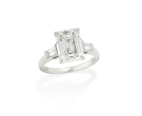 DIAMOND SINGLE-STONE RINGThe step-cut diamond, weighing 4.01 carats, between tapered baguette-cut diamond shoulders, mounted 