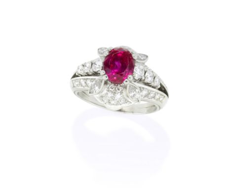 RUBY AND DIAMOND DRESS RINGThe oval-cut ruby, weighing 2.53 carats, the bifurcated shoulders set with brilliant-cut diamonds,