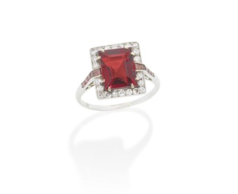 ART DECO SPINEL AND DIAMOND RING, CIRCA 1930The step-cut red spinel, weighing approximately 4.35 carats, within a surround of