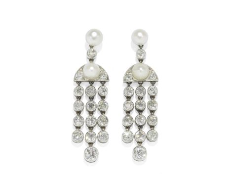 PEARL AND DIAMOND EARRINGS, CIRCA 1920Each bouton pearl surmount issuing three articulated rows of old brilliant-cut diamonds