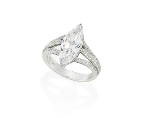 BOODLES: DIAMOND SINGLE-STONE RING, 2002The marquise-cut diamond, weighing 3.23 carats, between trifurcated shoulders set wit