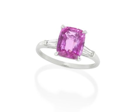 PINK SAPPHIRE SINGLE-STONE RINGThe cushion-shaped sapphire, weighing 4.07 carats, between tapered baguette-shaped diamond sho