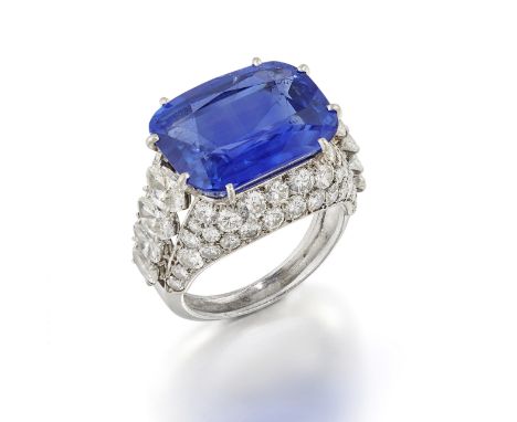 CARTIER: SAPPHIRE AND DIAMOND DRESS RING, MID 20TH CENTURYThe cushion-shaped sapphire, weighing 14.81 carats, between graduat