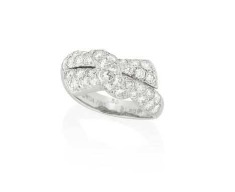 VAN CLEEF &amp; ARPELS: DIAMOND RING, CIRCA 2000The stylised asymmetric bow pavé-set throughout with brilliant cut diamonds, 