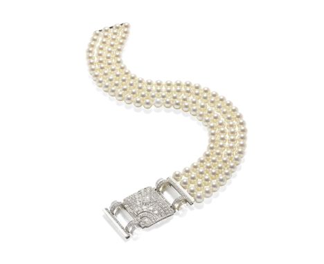 SEAMAN SCHEPPS: ART DECO DIAMOND AND ROCK CRYSTAL CLASP, CIRCA 1935-40The openwork rectangular plaque set throughout with old