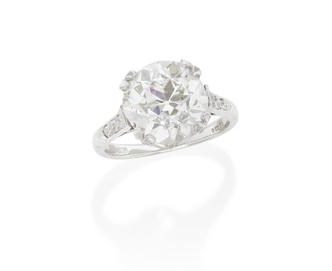 DIAMOND SINGLE-STONE RING, CIRCA 1920The old cushion-shaped diamond, weighing 7.18 carats, between single-cut diamond shoulde