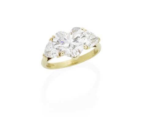 DIAMOND RINGThe heart-shaped diamond, weighing 3.64 carats, between trilliant-cut diamond shoulders, mounted in 18 carat gold