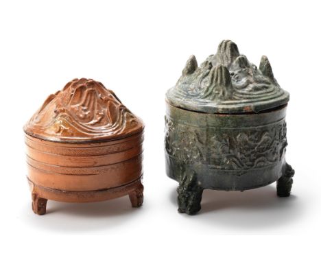 TWO GLAZED TRIPOD 'HILL' INCENSE BURNERS AND COVERSEastern Han DynastyThe amber-glazed tripod hill censer supported on three 