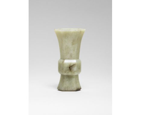 A PALE GREEEN JADE VASE, GU17th century Smoothly carved of flattened hexagonal form, with a recessed foot tapering to a bulbo