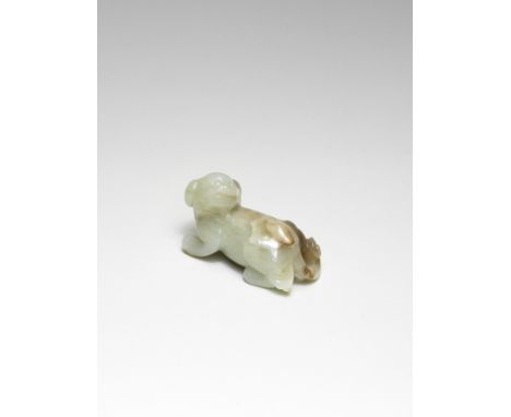 A PALE GREEN AND RUSSET JADE CARVING OF A DOGMing DynastyDeftly carved with its head turned backwards, with a naturalisticall