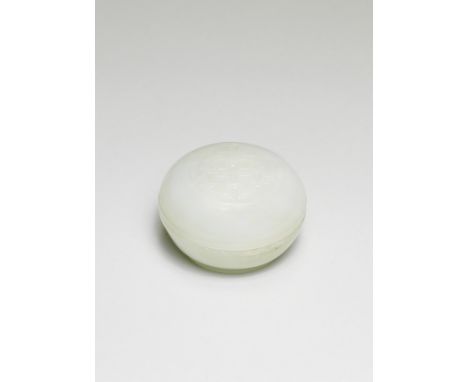 A WHITE JADE 'SHOU' CIRCULAR BOX AND COVER18th centuryThe body supported on a smaller foot ring, the domed cover  with a cent