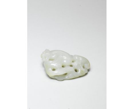 A PALE GREEN JADE CARVING OF A 'LINGZHI' GROUP17th/18th century Of irregular ovoid section, deeply hollowed to form a natural