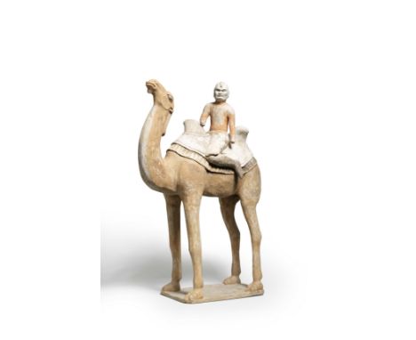 A LARGE PAINTED POTTERY MODEL OF A CAMEL WITH A 'FOREIGNER' RIDERTang DynastyThe tall powerfully-modelled camel standing four