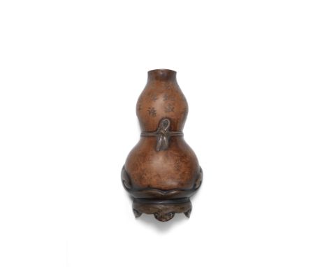 AN YIXING DOUBLE-GOURD WALL VASESigned Pengnian, Qing DynastyOf double-gourd form above the foot imitating a wooden stand, wi