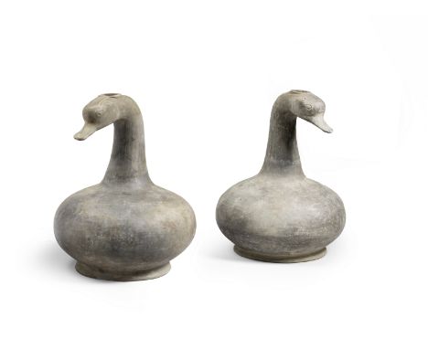 AN UNUSUAL PAIR OF GREY POTTERY GOOSE-HEAD BOTTLE VASESHan DynastyEach vase standing on a slightly spreading base, rising to 