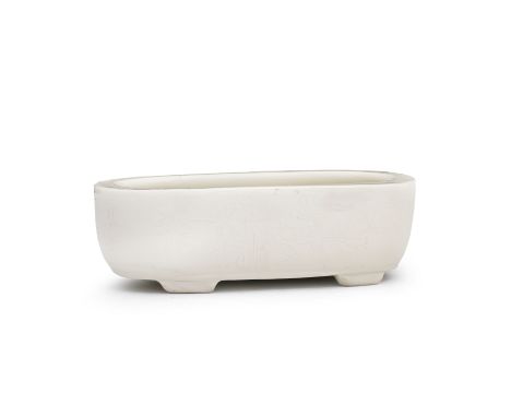 A BLANC-DE-CHINE OVAL JARDINIÈRE17th/18th centuryWith flaring side rising to an inverted lip supported on four bracket feet, 