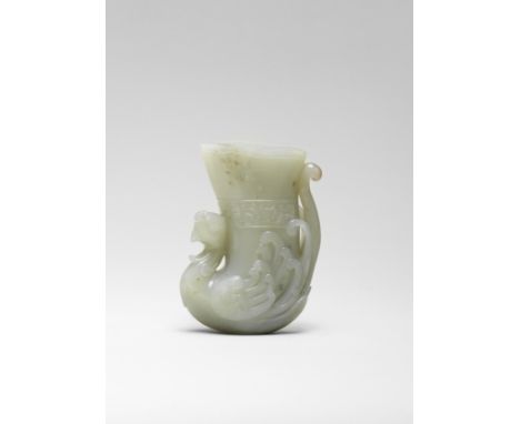 A PALE GREEN JADE 'PHOENIX' RHYTON CUP17th/18th centuryDeeply hollowed to form a slender cup with the head of a phoenix risin