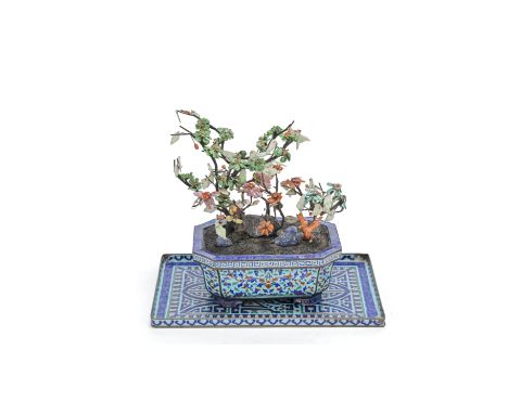 A HARDSTONE AND CORAL TREE IN A PAINTED-ENAMEL JARDINIÈRE18th/19th centuryThe tree modelled with flowering leafy branches amo