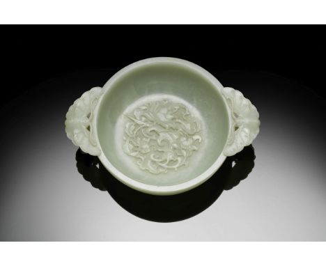 A VERY FINE AND RARE PALE GREEN JADE MARRIAGE BOWLQianlongSuperbly carved from a single piece of extremely pale whitish-green