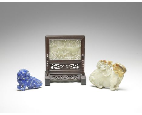 A PALE GREEN JADE OPENWORK PLAQUEMing DynastyOf rectangular form deftly carved in openwork with a Buddhist lion chasing a bro