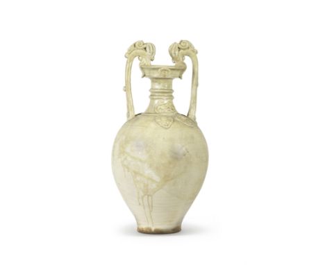 A RARE CREAM-GLAZED TWO-HANDLED AMPHORA VASETang Dynasty The well-rounded ovoid body rising from a flat foot, surmounted by a