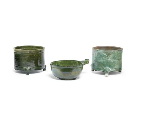 THREE GREEN-GLAZED VESSELSEastern Han DynastyComprising two green-glazed tripod incense burners,  The larger, 20.5cm (8in) di