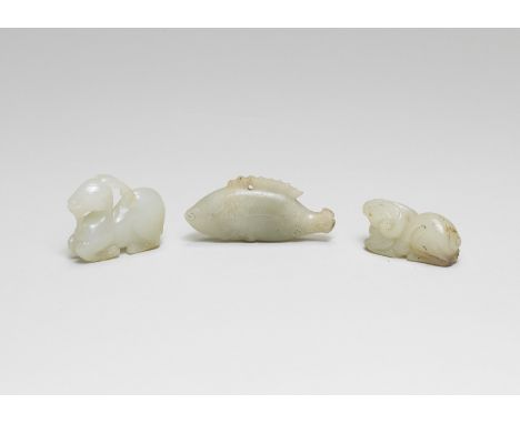 THREE SMALL WHITE JADE CARVINGSSong/Ming DynastyComprising of a pale green jade carving of a fish, Song dynasty, naturalistic