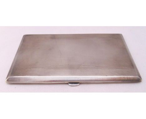 A hallmarked silver engine turned cigarette case, approx weight of silver 208g