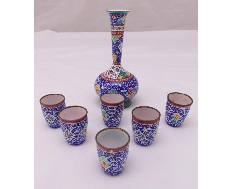 A Middle Eastern enamel and base metal vase and six matching tumblers decorated with flowers, leaves and scrolls