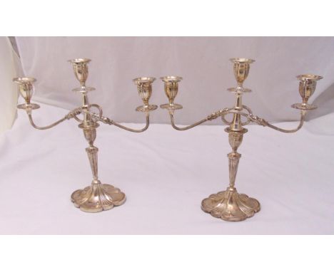 A pair of hallmarked silver three light candelabra, fluted oval stems on shaped oval bases, Birmingham 1973, 39cm (h)