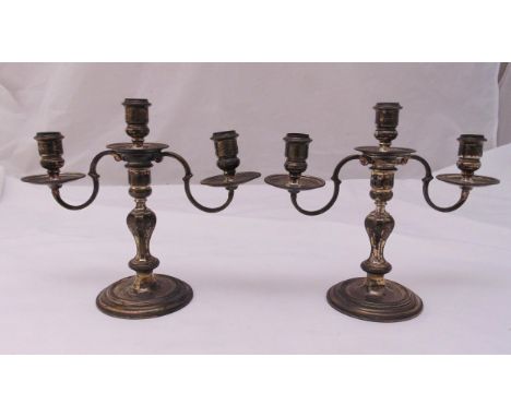 A pair of hallmarked silver three light candelabra, panelled baluster stems on raised circular bases, Birmingham 1951, approx